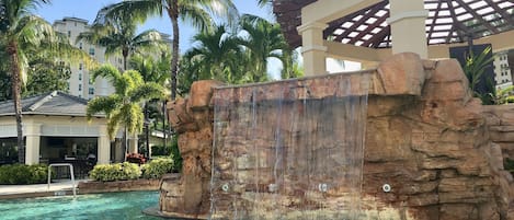 Amazing resort style pool with several waterfalls, zero entry and tiki bar.