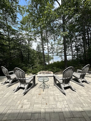 Patio with firepit overlooking Togus Pond