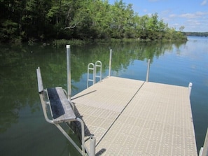 End of dock with seating and swimming ladder