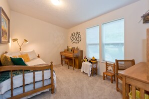 Parlor has piano, desk and trundle bed sleeping two