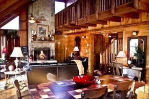 Family Room   w/ Heart of Pine Floors open to Kitchen and Balcony with Staricase