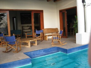 The pool is integrated into the patio. It overlooks the beautiful Pacific.