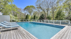 4 sun loungers on raised deck
