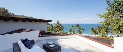 rooftop lounge with view of the beach and gulf