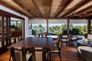 upstairs covered deck, dining and living