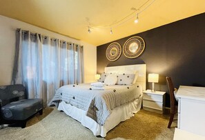 First floor master bedroom has queen-sized bed with pillow top mattress