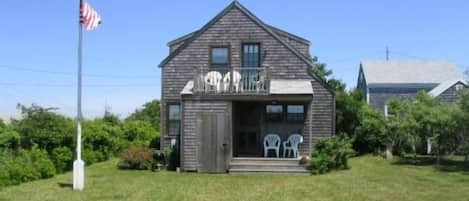 Large side yard and smaller yard on other side of house.  New kitchen!