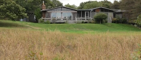 Front of house seen across meadow
