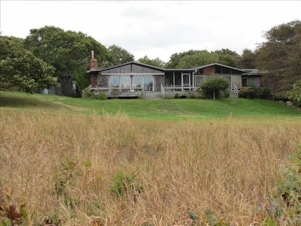 Front of house seen across meadow