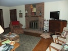 Family room with wood burning fire place