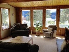 Cozy living room with sweeping views of the lake and mountains