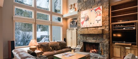 Spacious living room with views of Bald Mt. and fireplace... high ceilings.