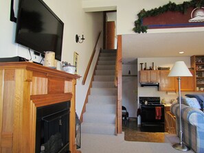 View from balcony door up stairs and towards kitchen