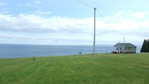 Long shot from driveway entrance to the cottage