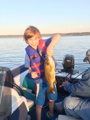 Happiness is his first keeper Smallmouth Bass.