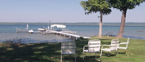 Enjoy your private beach with dock and boat hoist.