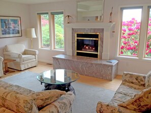 Find a cozy spot by the fire and admire the view