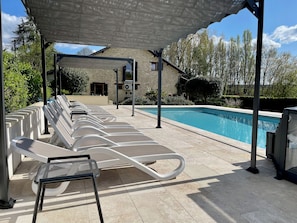 Lots of luxury sun loungers and pool side shade