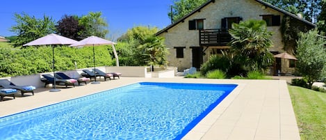 Large pool terraces with lots of sun loungers and shade