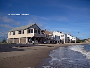 Sandy private beach on the water. Large screened porch with beach deck below.