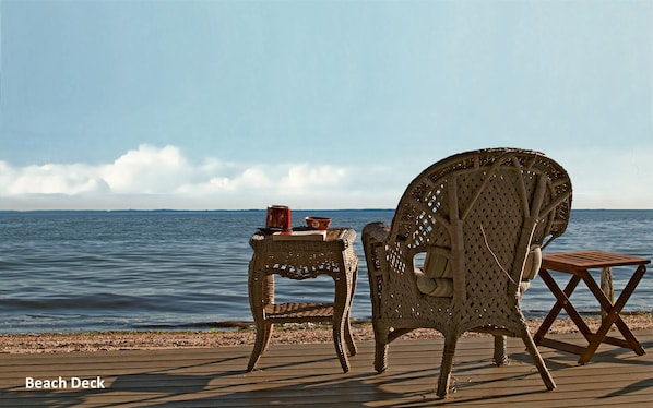 Relax on the wall-to-wall beach deck. Has both sunny and shaded, covered areas.