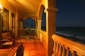 The front terrace at night. Enjoy cocktails, breezes, and the sound of the waves