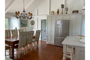 Newly updated chef's kitchen; Farm table seats 8-10. Slider to deck and bbq. 