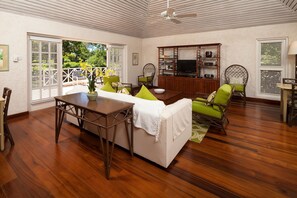 Hunter_living room with cable TV opening to large open patio 