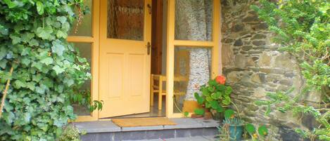 The front door opens into the courtyard garden