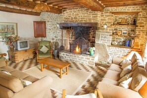 The lounge with huge Normandy open fire