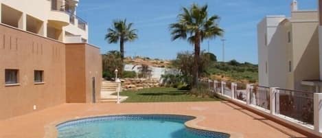 Swimming pool view towards beach and garden