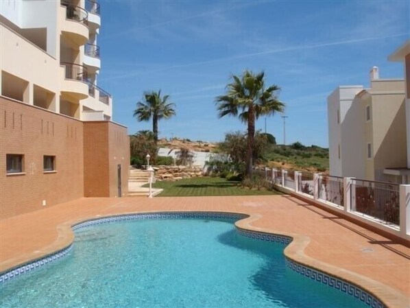 Swimming pool view towards beach and garden