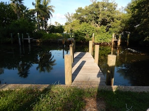 Canal view from screened porch and gardens.