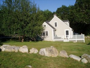 Tennis Cottage with court visible on the left