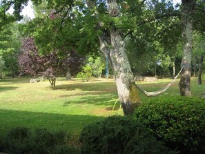 Leafy mature garden surrounds the villa