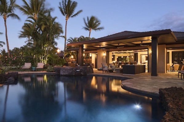 EVENING VIEWS OF EXPANSIVE LANAI & POOL WITH PALMS SWAYING IN THE TRADEWINDS