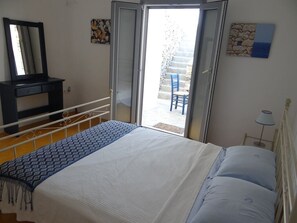 bedroom 1 with outside patio and access to sea view
