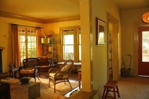 Living room with fireplace and hallway