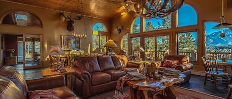 Great Room is the focal point for gathering with fabulous Pikes Peak views
