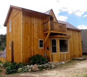 View toward the north of the cabin from River Street.