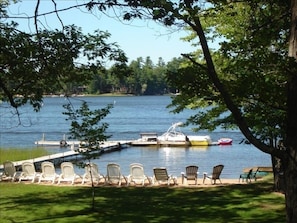 Our view from the wrap around deck overlooking our shared sandy beach and lake!