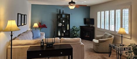 Living Room with Fireplace, Mountain and Pool Views