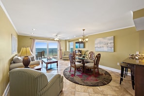 VIEW OF LIVING AREA & NEW SLIDING GLASS DOORS MAKE EASY ACCESS TO THE BALCONY. 