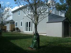 Left Side Yard / Deck Over Pool House View. Outside shower, grill, picnic tables