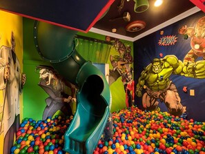 Slide into the superhero ballpit bedroom!