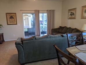 Living room with view of enclosed patio