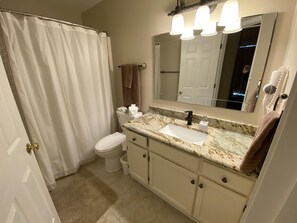 Master bath with tub shower, granite vanity with under mount sink