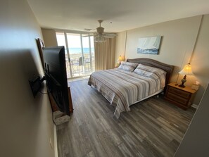 Master bedroom with 55 inch smart TV and ocean view