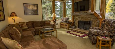 Gorgeous living room with sectional sofa and fireplace; exceptional space