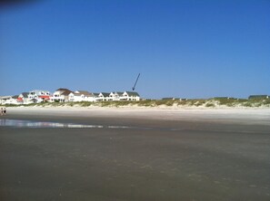 At low tide ocean's edge looking back to our condo. Wide open views & beach